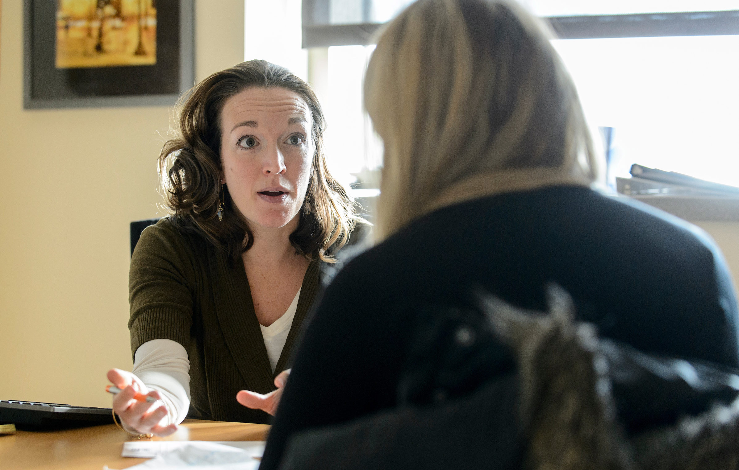 advisor talking to student in an advising meeting