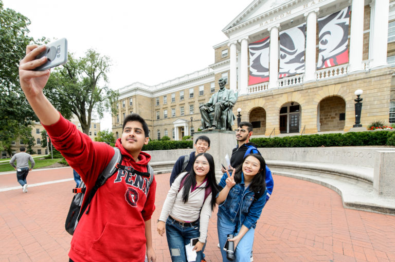 student taking selfie in front of bascom hall