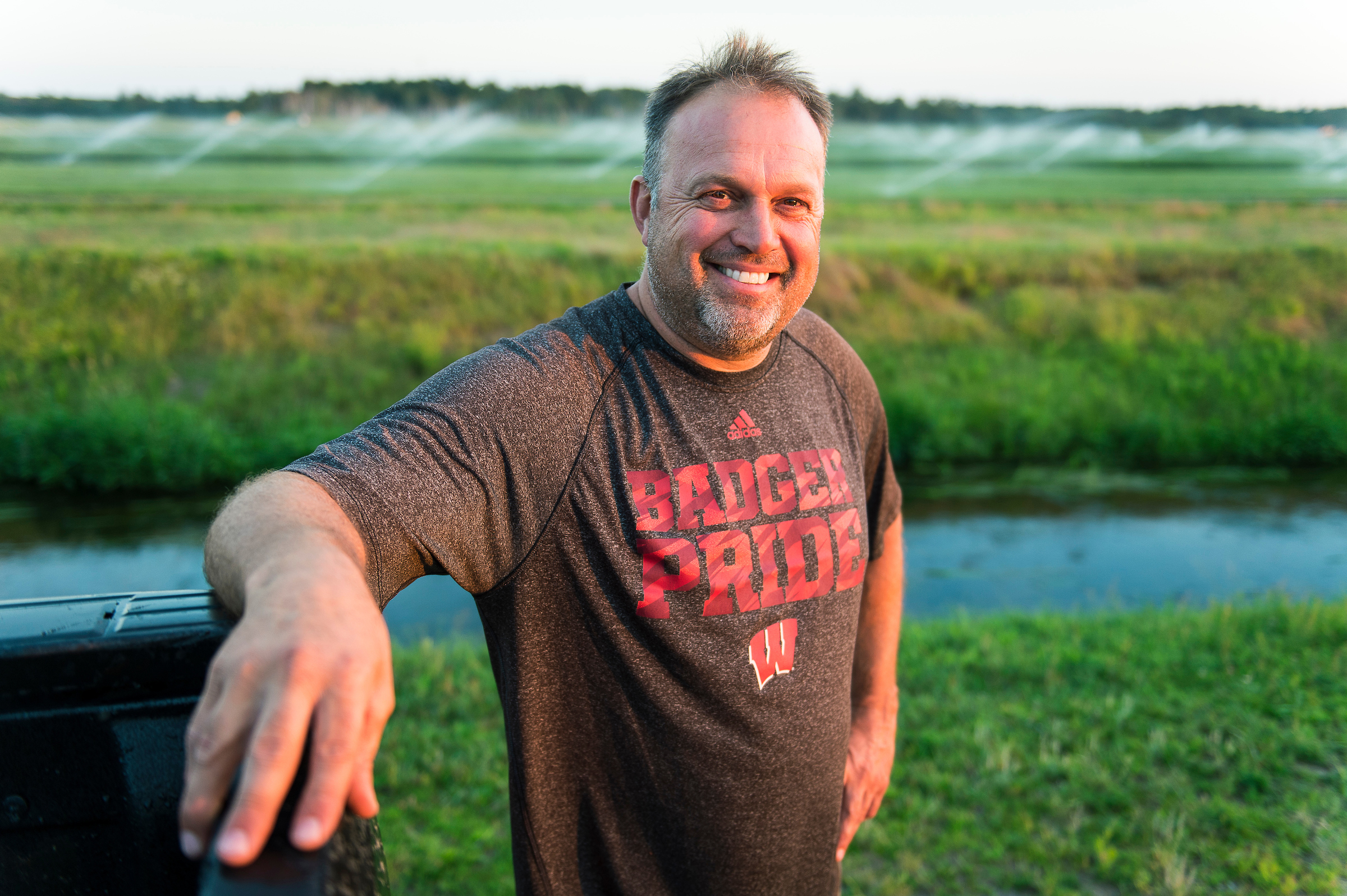 Middle-age man wearing badger pride shirt